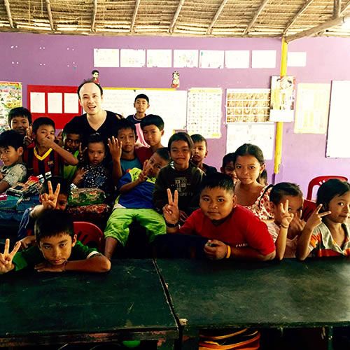 Colin Wong visiting a Cambodian school for orphans