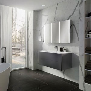 The mirror profile on this Xenon cabinet reflects the wall or tile so the cabinet will enhance the bathroom's decor