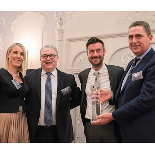 David Meyerowitz, chief operating officer at Hoover Candy Group (middle left), and Chris Bennett Hoover channel director (middle right), receiving the exclusive CIH Award.