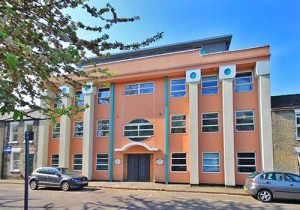 Block of flats in Cambridge containing kitchen featured above