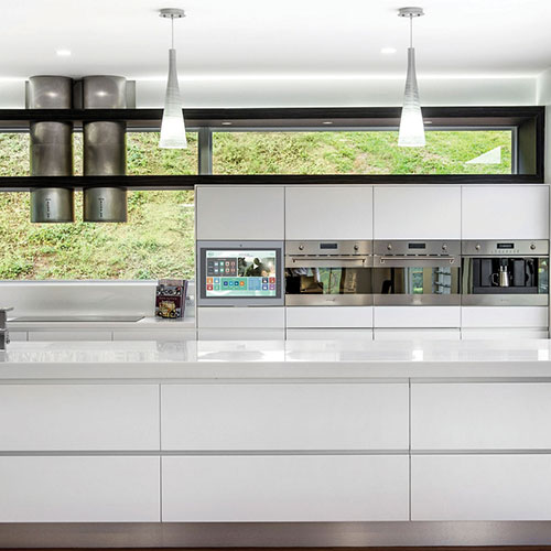 A kitchen featuring the Hubit smart-home control panel from Coolvision