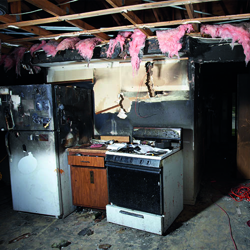 Charred kitchen in a house gutted by fire